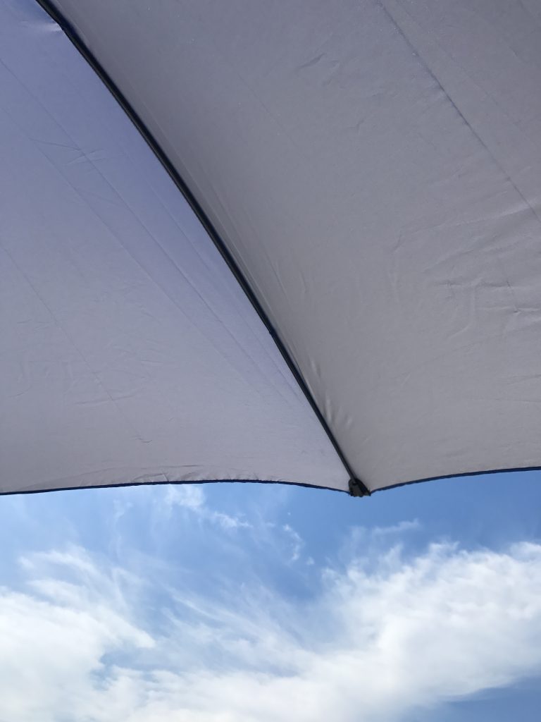 Umbrella shielding the sun at Robert Moses Beach.