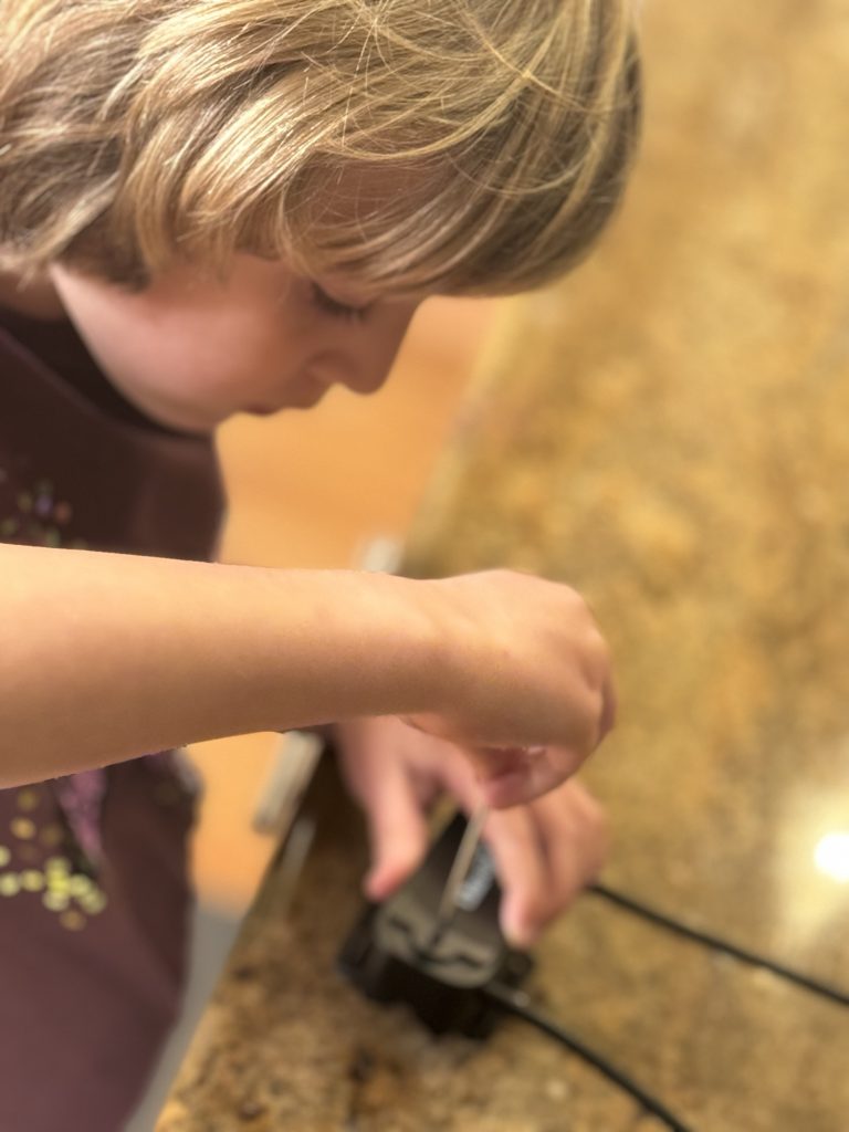 My daughter with a tool.